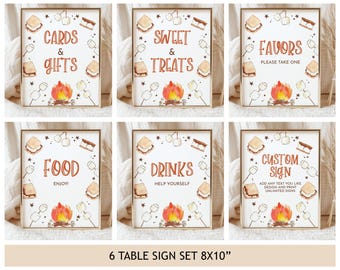 May include: A set of six framed table signs with a camping theme. Each sign features a watercolour illustration of a campfire, marshmallows, and s'mores. Text includes "Cards & Gifts," "Sweet & Treats," "Favors," "Food," "Drinks," and "Custom Sign."