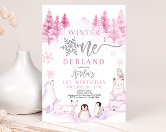May include: A pink and white winter wonderland themed first birthday party invitation with a silver glitter snowflake and the text "Winter One Derland celebrating Amelia's 1st Birthday". The invitation includes details for the party, including the date, time, and location.