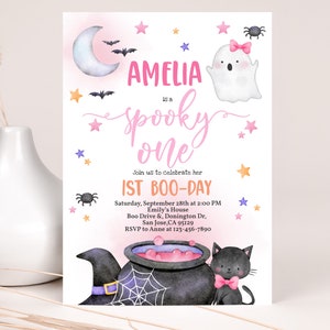 May include: A pink and purple Halloween-themed first birthday party invitation with a ghost, a black cat, a cauldron, and stars. The invitation says "Amelia is a spooky one" and includes the date, time, and location of the party.