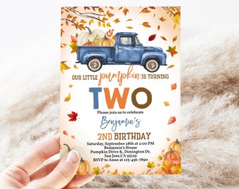May include: A blue pickup truck with a pumpkin patch in the back. The truck is driving on a road with fall leaves on the ground. The text "OUR LITTLE PUMPKIN IS TURNING TWO" is written on the invitation.