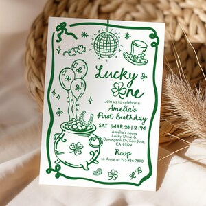 May include: A green and white invitation card with the text "Lucky One" and "Amelia's First Birthday." The design includes a pot of gold, balloons, a disco ball, and a leprechaun hat. The RSVP information is included.