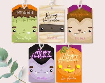 May include: Five Halloween gift tags featuring various monster characters. Each tag has a purple, orange, brown, or green background with the text "Happy Halloween" and "Love Amelia".