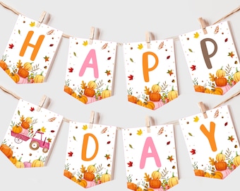 May include: A white banner with the word "HAPPY" in orange and pink letters and the word "DAY" in pink letters. The banner is decorated with fall leaves and pumpkins.