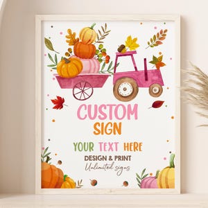 May include: A printable sign with a pink tractor carrying a stack of pumpkins. The sign says "Custom Sign" and "Your Text Here". The background is white with fall-themed illustrations.