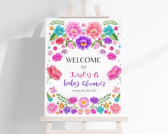Puede incluir: Bienvenido a la fiesta de bienvenida al bebé de Emily con un diseño floral colorido. El cartel presenta flores rosas, moradas, azules y amarillas con hojas verdes. El texto en el cartel dice "Bienvenido a la fiesta de bienvenida al bebé de Emily" y "Sábado, 28 de mayo de 2028".