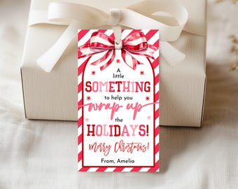 May include: A gift tag with a red and white striped border and a bow illustration. The tag reads "A little SOMETHING to help you wrap up the HOLIDAYS! Merry Christmas! From, Amelia."