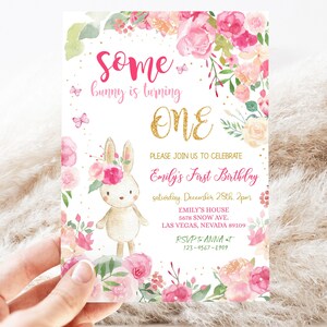 May include: A pink and gold floral birthday invitation with a cute bunny rabbit illustration. The invitation says "Some bunny is turning ONE" and includes details for Emily's First Birthday party.