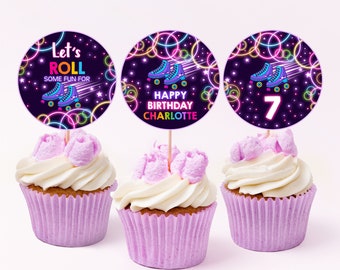 May include: Three purple cupcake cases with white icing and colourful roller skate themed cupcake toppers. The toppers say "Let's Roll Some Fun For", "Happy Birthday Charlotte", and "7".