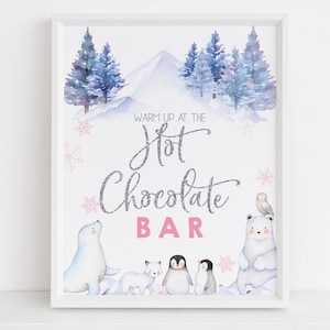 May include: A printable sign with a winter theme featuring a snowy mountain, pine trees, and animals. The text reads "Warm up at the Hot Chocolate Bar".