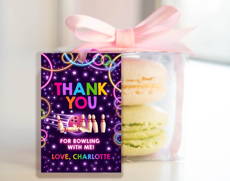 May include: A purple thank you tag with neon green and pink circles and stars. The tag says "Thank You" in rainbow letters and "For bowling with me! Love, Charlotte".