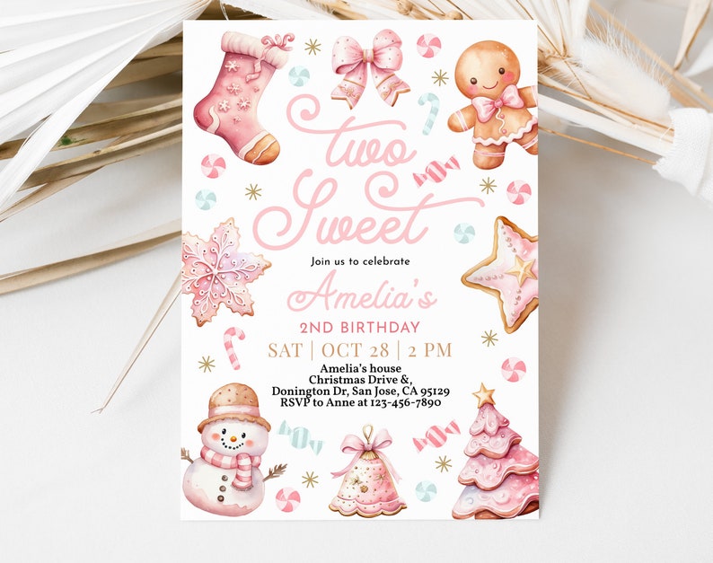 May include: Pink and gold invitation for a girl's 2nd birthday party. The invitation features a gingerbread theme with a gingerbread man, a gingerbread stocking, and a gingerbread tree. The text on the invitation reads "Two Sweet Amelia's 2nd Birthday".