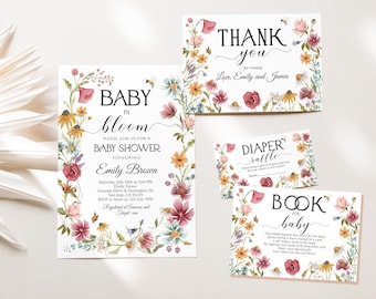 May include: A floral themed baby shower invitation with a watercolor design. The invitation says "Baby in Bloom" and includes details for the shower, including the date, time, location, and RSVP information. The invitation also includes a thank you card and cards for a diaper raffle and a book for baby.