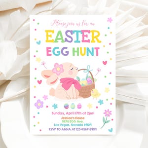 May include: A colorful invitation for an Easter egg hunt. The invitation features a cartoon bunny holding a basket of eggs. The text reads "Please join us for an Easter Egg Hunt. Sunday, April 17th at 2pm. Jessica's House, 5678 EGG Ave. Las Vegas, Nevada 89109. RSVP to ANNA at 123-4567-8909."