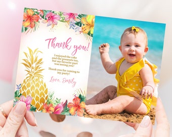 May include: A pink and gold thank you card with a pineapple design and a photo of a baby girl in a yellow swimsuit on a beach. The text on the card reads "Thank you! I enjoyed the cake and the presents too, but my favorite part was seeing you! Thank you for coming to my party! Love. Emily"