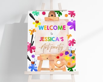 May include: Welcome to Jessica's Art Party sign with a colorful paint splattered background. The sign features a wooden easel with a paint palette and paintbrushes.