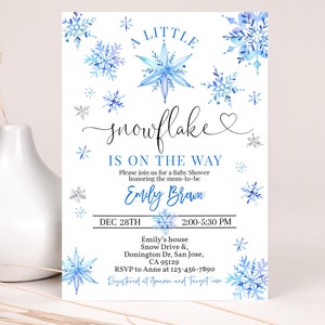 May include: A blue and white baby shower invitation featuring a snowflake design. The invitation reads "A Little Snowflake is on the Way" and includes the date, time, and location of the shower. It also includes the name "Emily Brown" and the RSVP information.