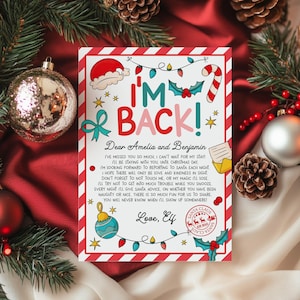 May include: A festive Christmas letter with the words "I'M BACK!" in large, colourful letters. The letter is decorated with illustrations of a Santa hat, candy cane, and Christmas lights. The letter is addressed to Amelia and Benjamin.
