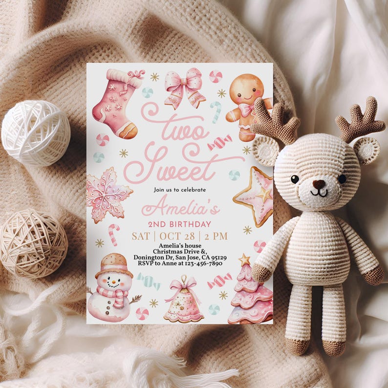 May include: A pink and white Christmas-themed invitation for a 2nd birthday party. The invitation features a gingerbread man, a stocking, a candy cane, a snowflake, a star, a snowman, a Christmas tree, and a bell. The text on the invitation reads "Two Sweet Amelia's 2nd Birthday Sat | Oct 28 | 2 PM Amelia's house Christmas Drive & Donington Dr, San Jose, CA 95129 RSVP to Anne at 123-456-7890".