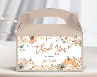 May include: A brown favor box with a white label featuring a floral design with pumpkins and the text "Thank You for coming Love, Amelia".