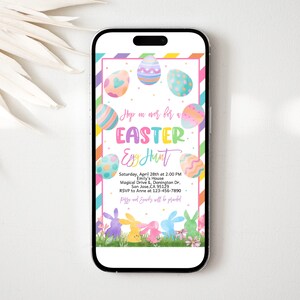 May include: A colorful Easter egg hunt invitation with a phone screen background. The invitation features a rainbow striped border, a white background, and a variety of colorful Easter eggs with pastel colors. The text reads "Hop on over for an Easter Egg Hunt" with the date, time, location, and RSVP information.