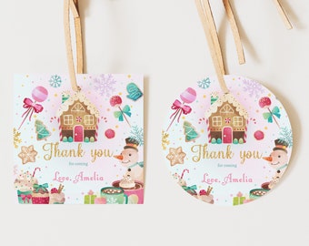 May include: Two thank you tags with a gingerbread house, snowman, candy canes, and cupcakes. The text on the tags reads "Thank you for coming Love, Amelia".