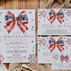 May include: A set of baby shower invitations and inserts with a patriotic theme. The invitations feature a bow with a red, white, and blue American flag design, fireworks, and text that reads "A Little Firecracker is on the Way."