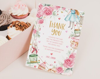 May include: A pink and white thank you card with a gold glitter font. The card features a whimsical Alice in Wonderland theme with illustrations of Alice, the Mad Hatter, and teacups. The text reads "Thank You" and includes a message expressing gratitude for attending a birthday party.
