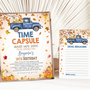 May include: A blue pickup truck with pumpkins in the bed, driving through a fall scene with orange and brown leaves. The truck is in front of a sign that says "Time Capsule Sealed Until 20XX To Be Opened On Benjamin's 18th Birthday". The sign also includes a message about writing a sweet message for the birthday person.  A separate card says "Dear, Benjamin" and has lines for writing a message.