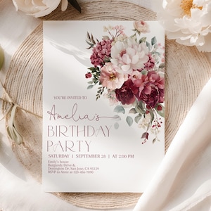 May include: A rectangular birthday party invitation card featuring a floral arrangement of burgundy, pink, and white flowers. The text reads: YOU'RE INVITED TO Amelia's BIRTHDAY PARTY SATURDAY | SEPTEMBER 28 | AT 2:00 PM Emily's house Donington Dr, San Jose, CA 95129 RSVP to Anne at 123-456-7890.