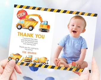 May include: A thank you card with a watercolor illustration of construction vehicles and a photo of a smiling baby. The card says "Thank You" and "I enjoyed the cake and the presents too, but my favorite part was seeing you! Thank you for coming to my party! Love, Benjamin."