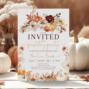 May include: A fall-themed invitation card with text that reads "You're Invited to a First Day Party" with floral and pumpkin illustrations. The card includes the name "Amelia Brown" and event details.