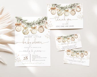 May include: A set of baby shower stationery with a festive design. The invitation reads "Merry Little Baby Shower" with the names "Emily & James." The design includes watercolor ornaments, greenery, and the words "thank you," "books for baby," and "diaper raffle."