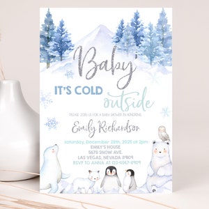 May include: A baby shower invitation with a winter theme. The invitation features a watercolor illustration of a snowy mountain scene with pine trees, snowflakes, and a variety of arctic animals. The text on the invitation reads "Baby It's Cold Outside" and includes the date, time, and location of the shower. The invitation is decorated with a silver glitter font.