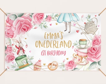 May include: A white banner with pink roses, a teacup, a teapot, and a Mad Hatter with a rabbit. The banner says "Emma's Onederland 1st Birthday" in gold glitter letters.