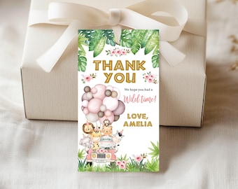 May include: A gift tag with a jungle theme. The tag features the words "THANK YOU" in gold lettering, along with a pink and brown balloon design and a safari jeep filled with cartoon animals. The text "We hope you had a Wild time!" is also included.