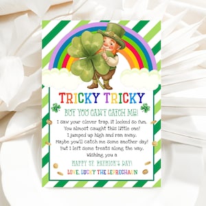 May include: A St. Patrick's Day greeting card with a leprechaun holding a large shamrock in front of a rainbow. The card has the text "TRICKY TRICKY BUT YOU CAN'T CATCH ME!" and a poem.