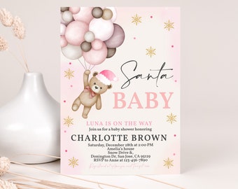 May include: A baby shower invitation with a pink and gold theme. The invitation features a teddy bear wearing a Santa hat, holding balloons. The text reads "Santa BABY" and includes event details.