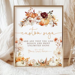 May include: A framed custom sign with a floral and pumpkin design. The sign has the words "custom sign" in gold script. The sign also includes the text "ADD ANY TEXT YOU LIKE DESIGN AND PRINT UNLIMITED SIGNS Your text here."