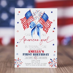 May include: A white invitation card with a patriotic theme. It features illustrations of American flags, fireworks, and a blue bow. The text reads "Our American girl is turning one" and includes details for Amelia's first birthday, July 28th.