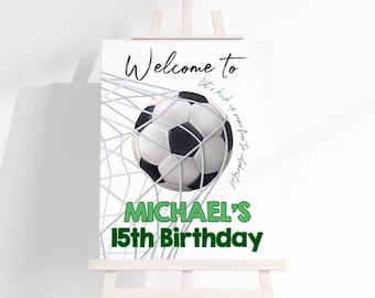 May include: Welcome to Michael's 15th Birthday party sign with a soccer ball in a net. The text "Let's kick up some fun to celebrate!" is written in green.