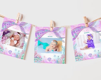 May include: Three pink and purple photo cards with a mermaid tail design. Each card has a photo of a baby in a different outfit. The cards are labeled "newborn", "six month", and "twelve months".