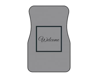 May include: Gray welcome mat with a black square and the word "Welcome" in a cursive font.