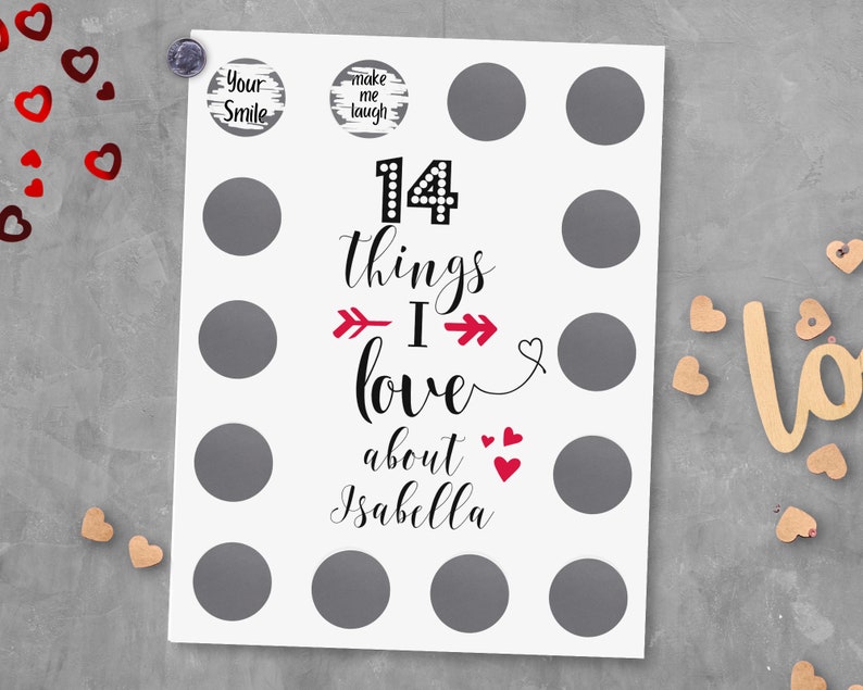 May include: A white card with 14 gray circles and the text "14 things I love about Isabella" in black and red. There are two smaller circles with the text "Your Smile" and "Make me laugh" in black and white.