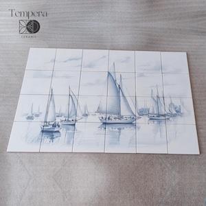 blue and withe tiles backsplash with boats in the sea