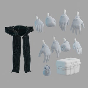 May include: A collection of objects, including a black garment, several white gloves, a small white container, and a grey cylindrical object. The gloves are in various poses, suggesting different hand gestures.