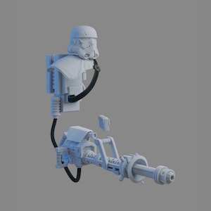 Puede incluir: Un modelo de plástico blanco de un Stormtrooper de Star Wars con un rifle bláster. El modelo está desmontado y las piezas están separadas.