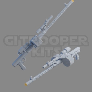 Puede incluir: Dos kits de modelos de ametralladoras de plástico gris. Las armas están detalladas con cañones, miras y cargadores. Los kits están listos para ser ensamblados y pintados.