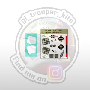 May include: A set of decals for a model spaceship, featuring a black and white design with a red stripe. The decals are labeled "SW ANH - Gold Leader 'Hutch' - Rebel Pilot".