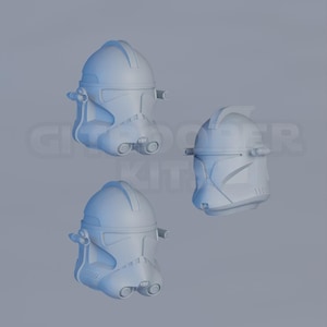 Op de afbeelding: Een set van drie keramische mokken met een gespikkelde, matte afwerking. De mokken zijn in de kleuren cr&egrave;me, lichtgrijs en donkergrijs. Elke mok heeft een eenvoudig, minimalistisch ontwerp en een afgeronde handgreep.