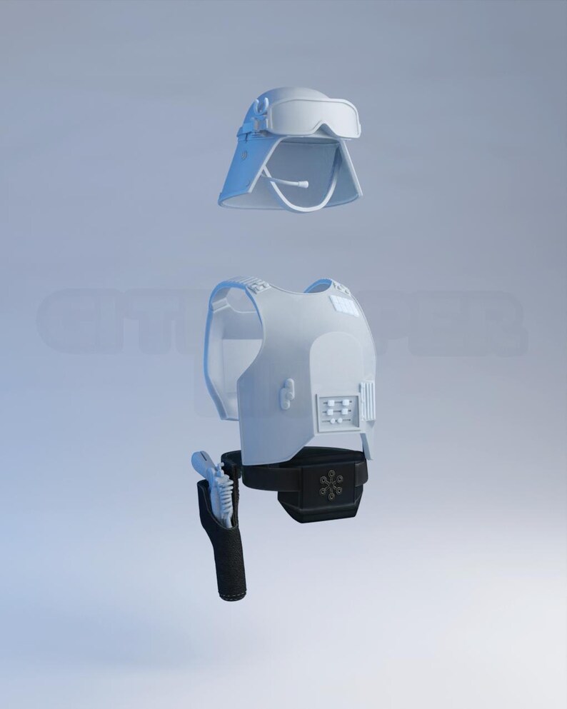 May include: A light gray military-style helmet with attached goggles, a matching vest, and a black holster with a brush. The items are displayed against a light blue background.